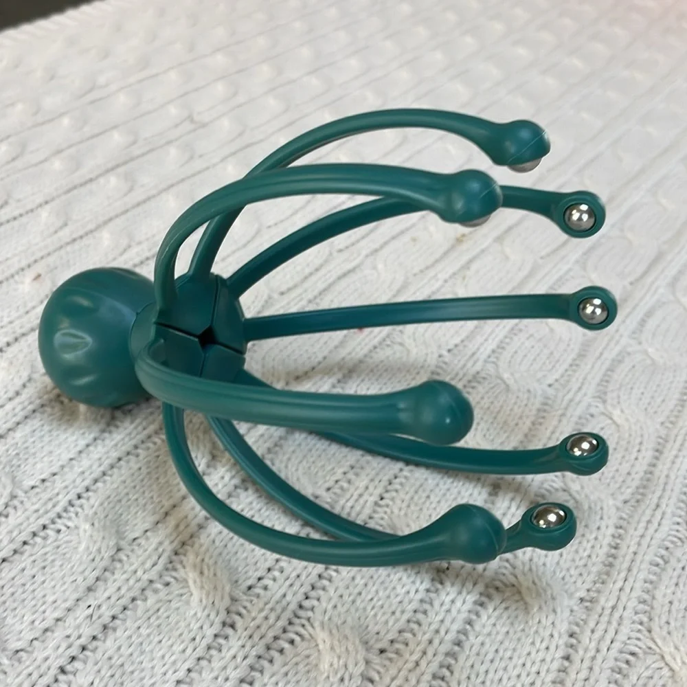 Scalp massager gently massages pressure points and sensitive nerves on head/neck